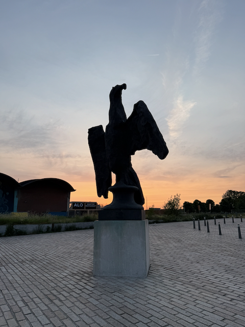 A statue in Antwerp at sunset
