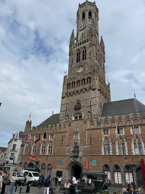 Belfry of Bruges- Towering over Markt Square since the 13th century, this medieval marvel once guarded the city’s treasures and still rings out melodies from its 47-bell carillon. A climb to the top rewards you with one of the best 