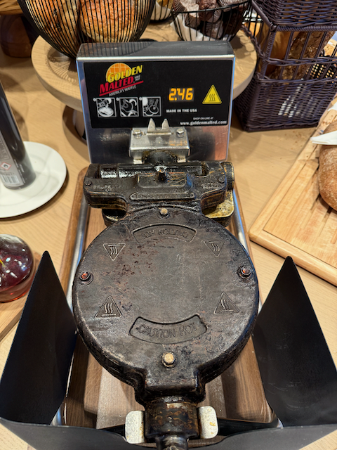 Breakfast in Belgium was a waffle made in an american waffle iron.
