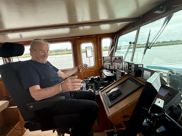 Captain Dick in the wheelhouse of the Iris