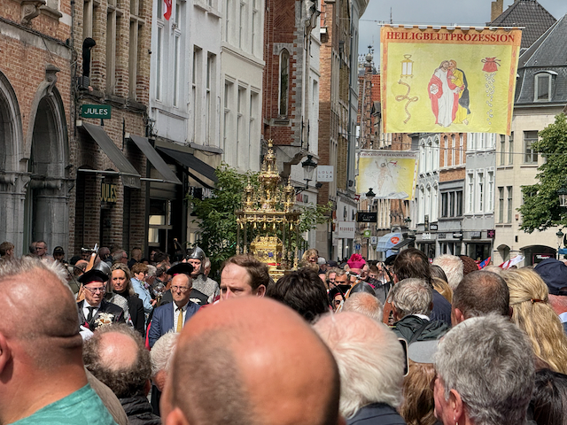 Everyone stands as the Relic containing the blood of Jesus passes by