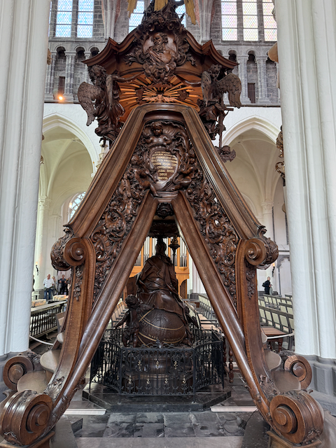In the heart of Bruges’ Church of Our Lady, this soaring altar seems to rise like a wooden wave — carved with care, crowned with light, and humming with centuries of quiet awe.