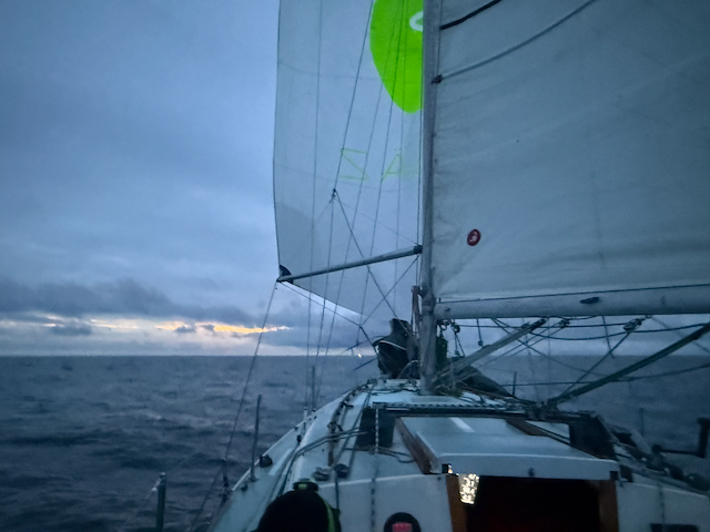 Rolling up the coast with the spinaker up.