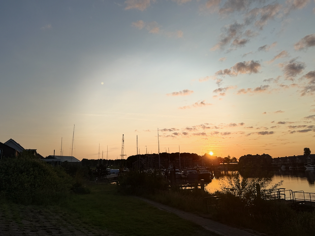Sun peeking up over the horizon in Tholen