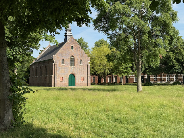 The chapel in the middle of the Bruges beguinage. The big open lawn and quiet trees make it feel really calm and tucked away from the city.