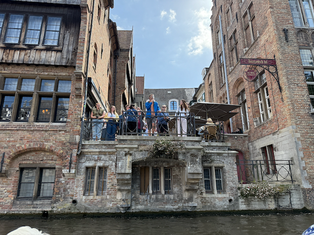 The heart of Bruges beats strongest at Rozenhoedkaai — where balconies brim with life and ancient stones remember the songs of salt traders and saints